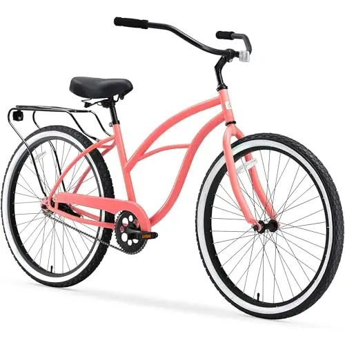 Sixthreezero women's coral-colored beach cruiser bike with a rear rack.