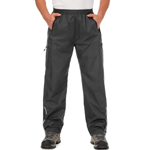 Jawtut Men's Waterproof Rain Over Pants in black, showing half-leg zip and pockets.