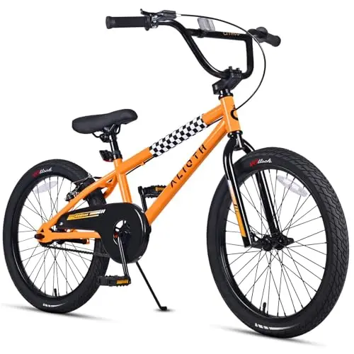 vollsch orange BMX-style bike with wide tires and a kickstand.