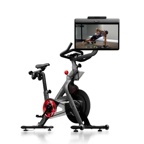 Peloton Bike+ in black with a large, rotating HD touchscreen.